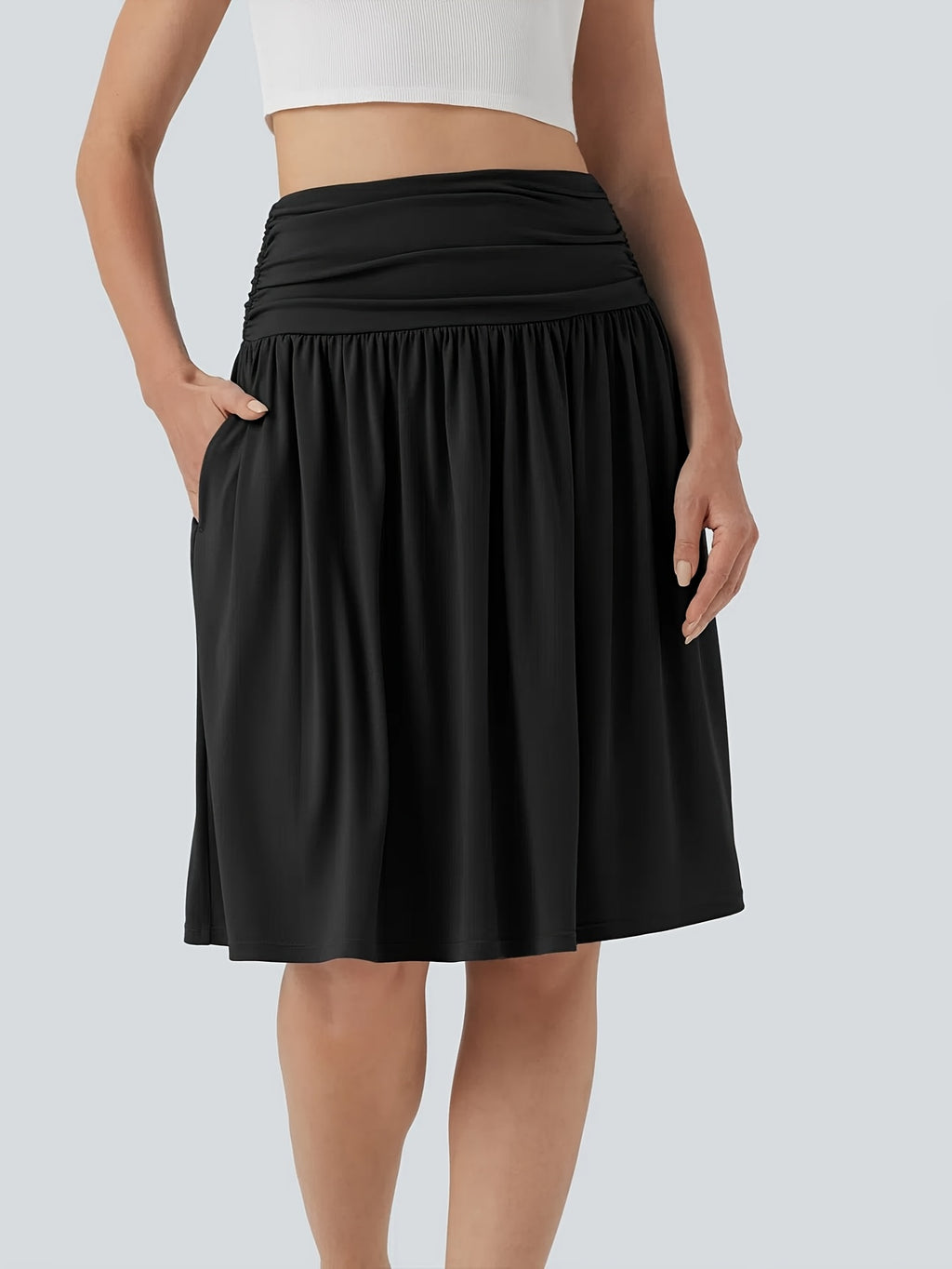 Jupe grande taille, coupe évasée, poches pratiques, porté de face