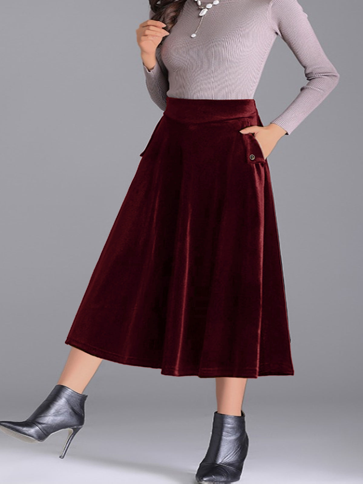 Jupe grande taille en velours, coupe évasée, toucher profond, allure élégante, détail du tissu