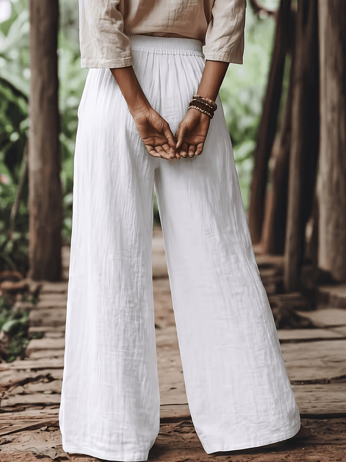 Pantalon grande taille, coupe évasée, toucher naturel, jambe large, vu de dos