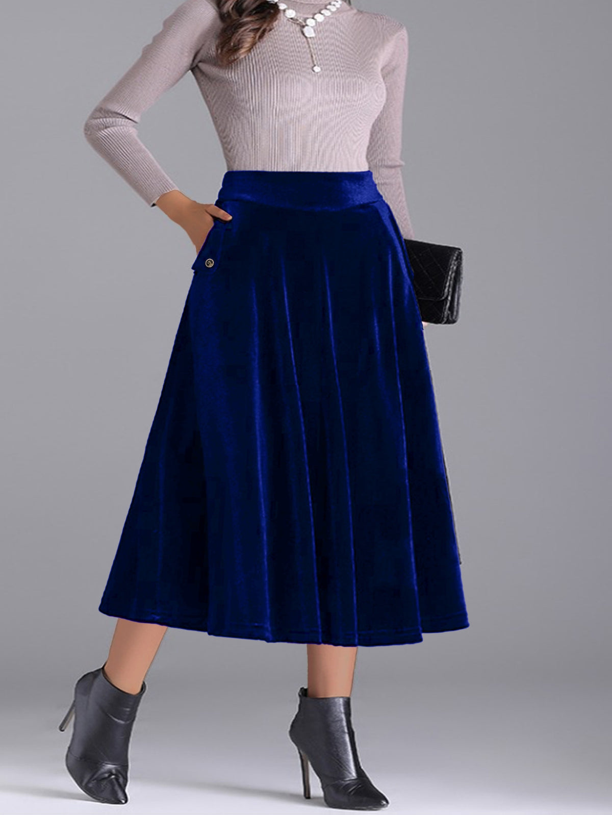 Jupe grande taille en velours, coupe évasée, toucher profond, allure élégante, détail du tissu