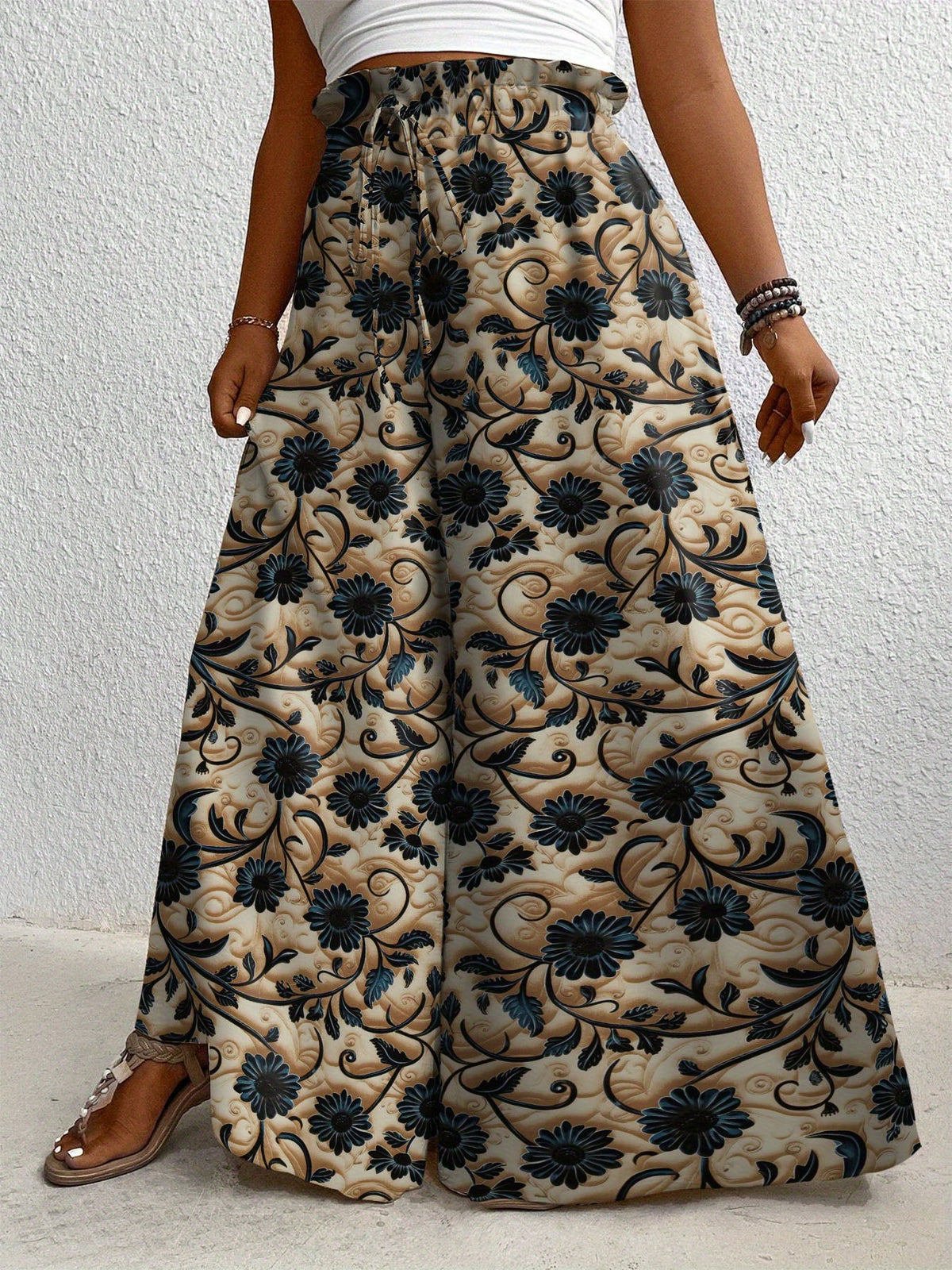 Pantalon grande taille à imprimé fleuri, coupe évasée, cordon, détail du tissu