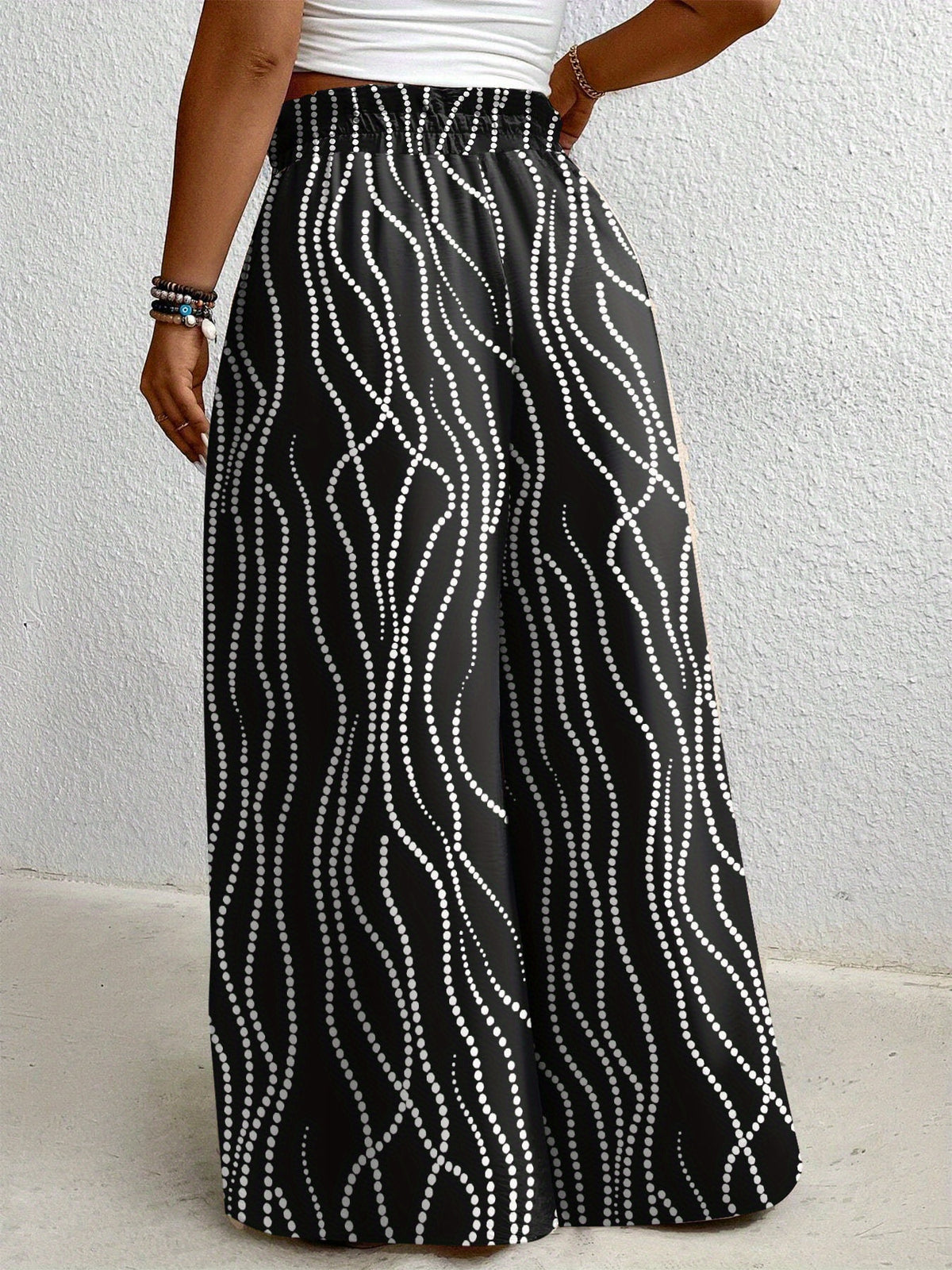 Pantalon grande taille à pois, coupe évasée, esprit vacances, vu de dos