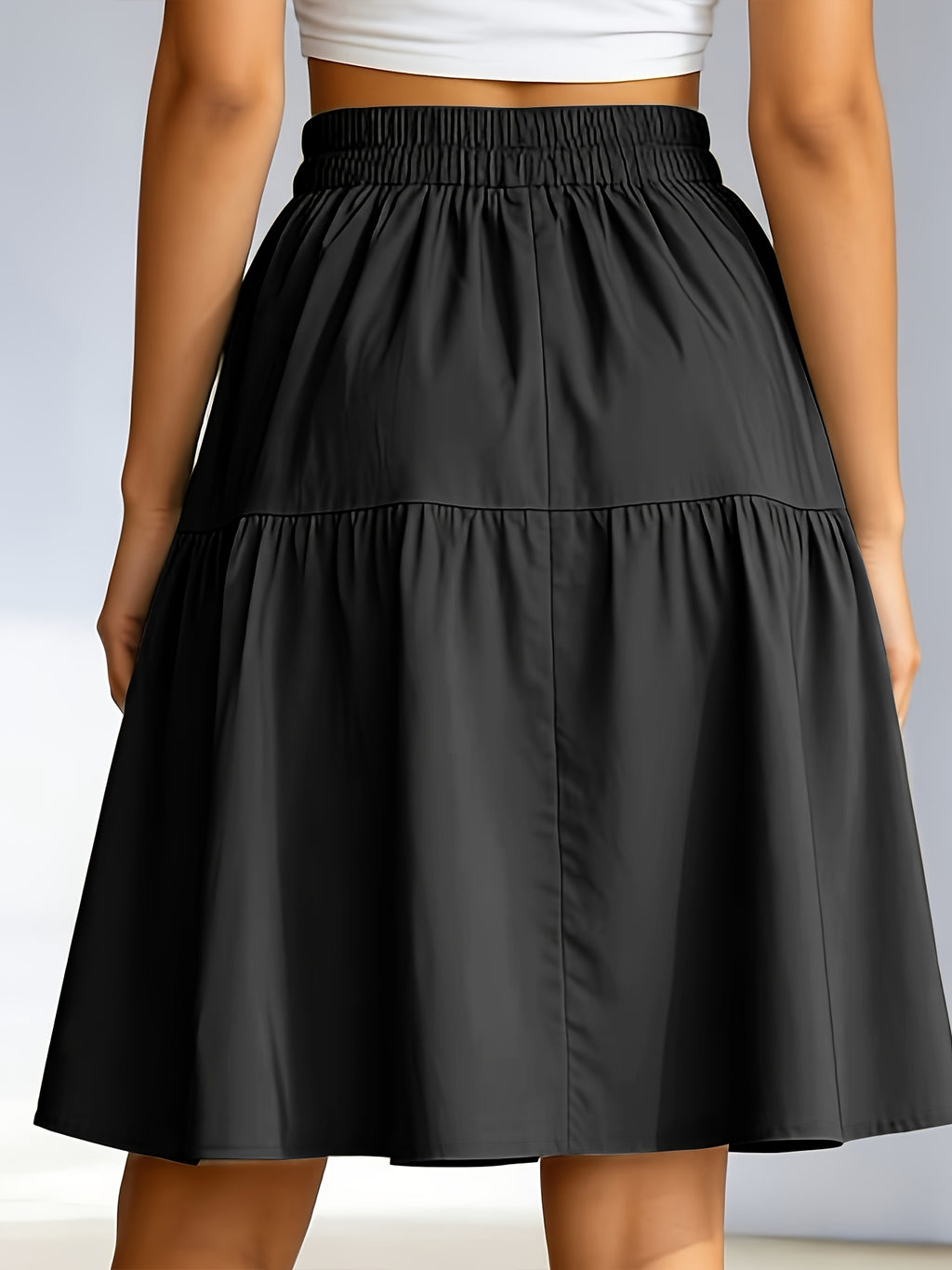 Jupe grande taille, coupe cintrée, poches pratiques, ligne nette, vu de dos