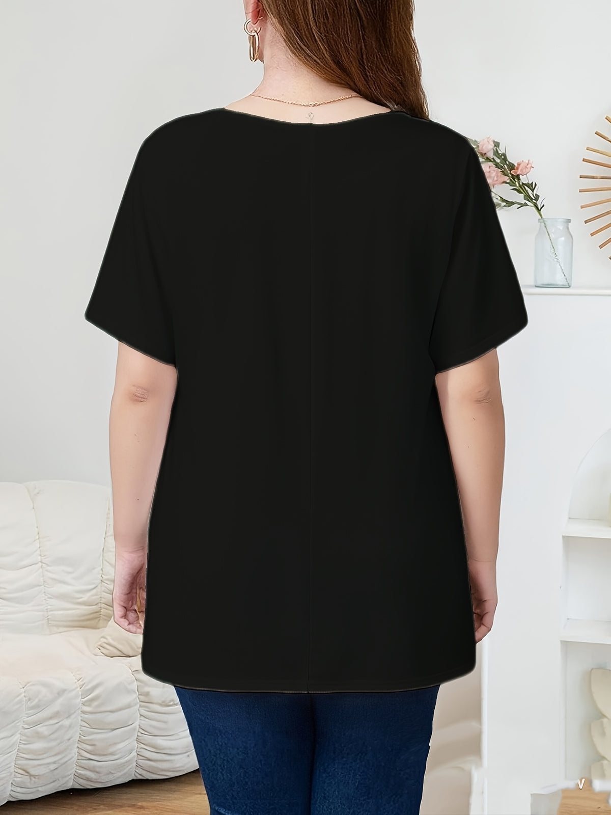 Top grande taille, coupe oversize, manches courtes, détail du tissu
