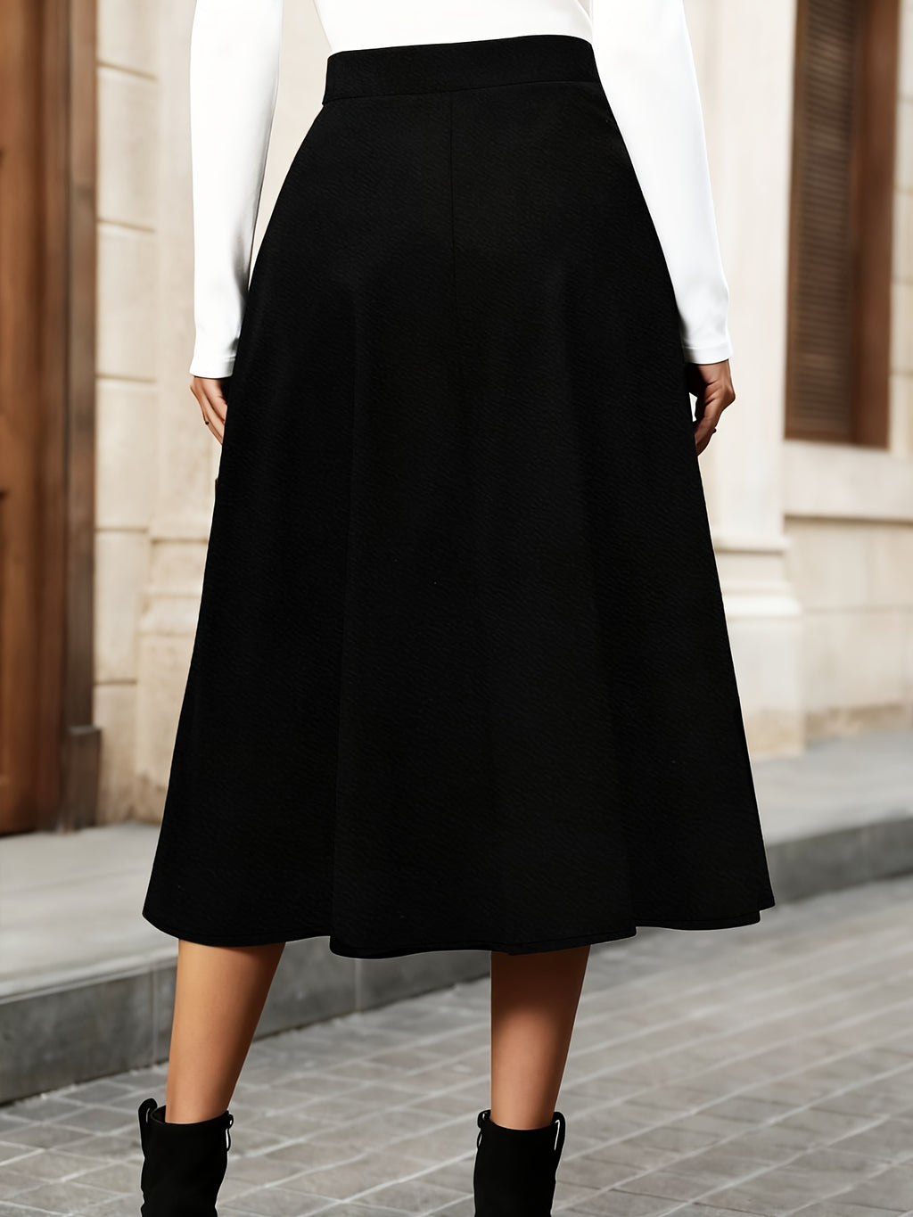 Jupe grande taille, coupe asymétrique, porté de face