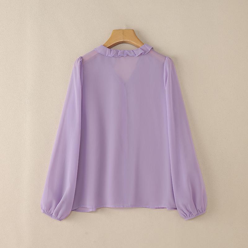 Top grande taille, coupe oversize, volants, manches longues, détail du tissu