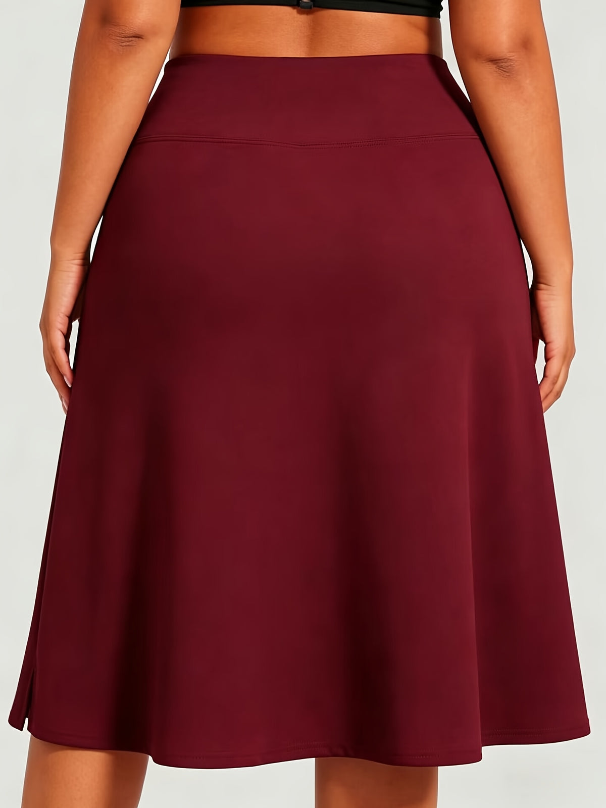 Jupe grande taille, poches plaquées, porté de face