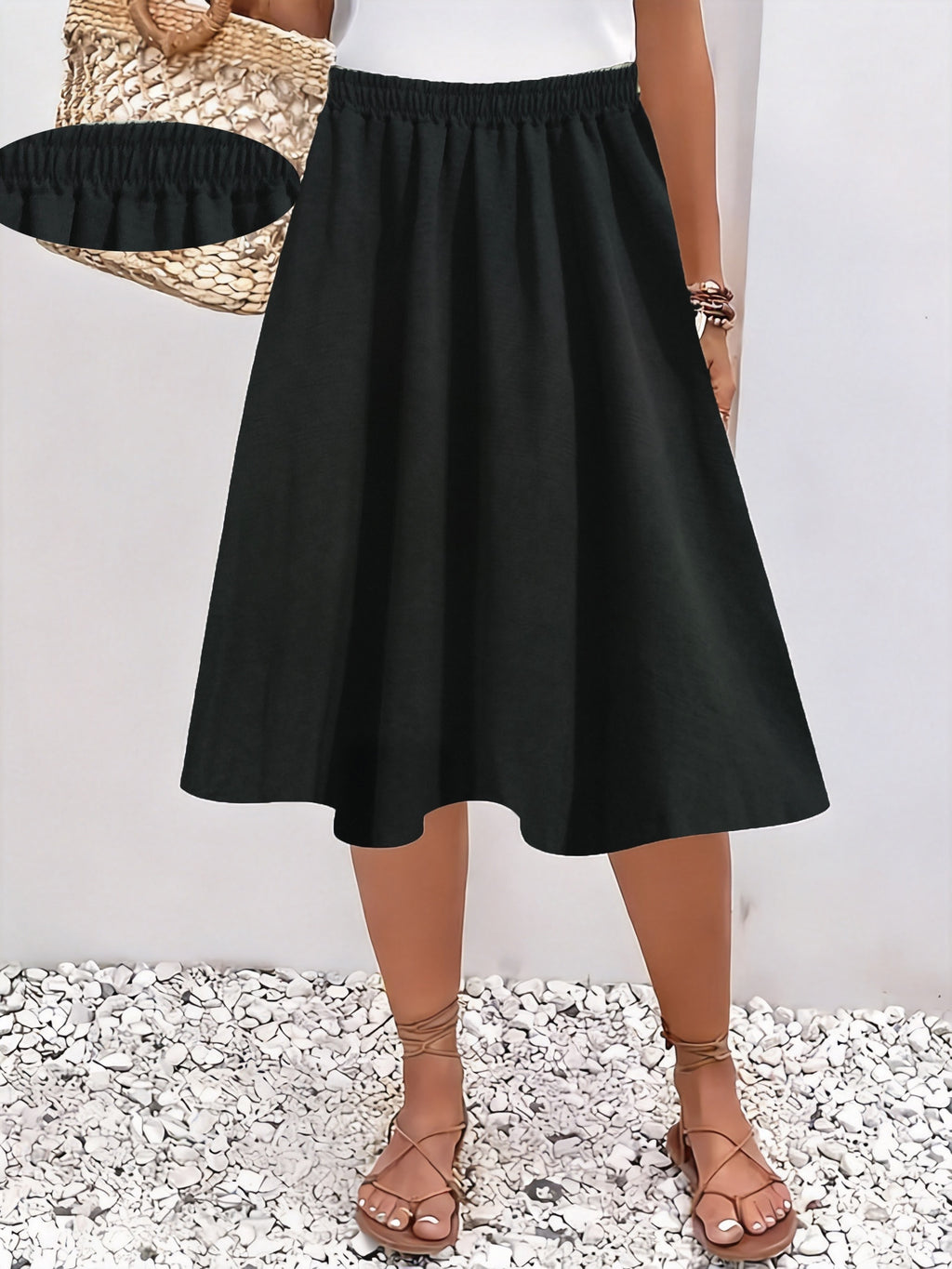 Jupe grande taille, coupe évasée, longueur genou, allure élégante