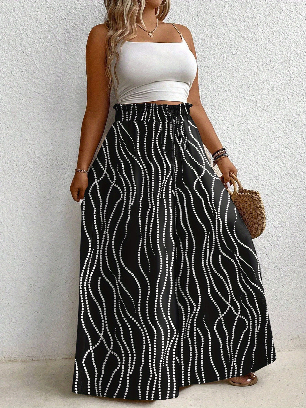 Pantalon grande taille à pois, coupe évasée, esprit vacances, porté de face