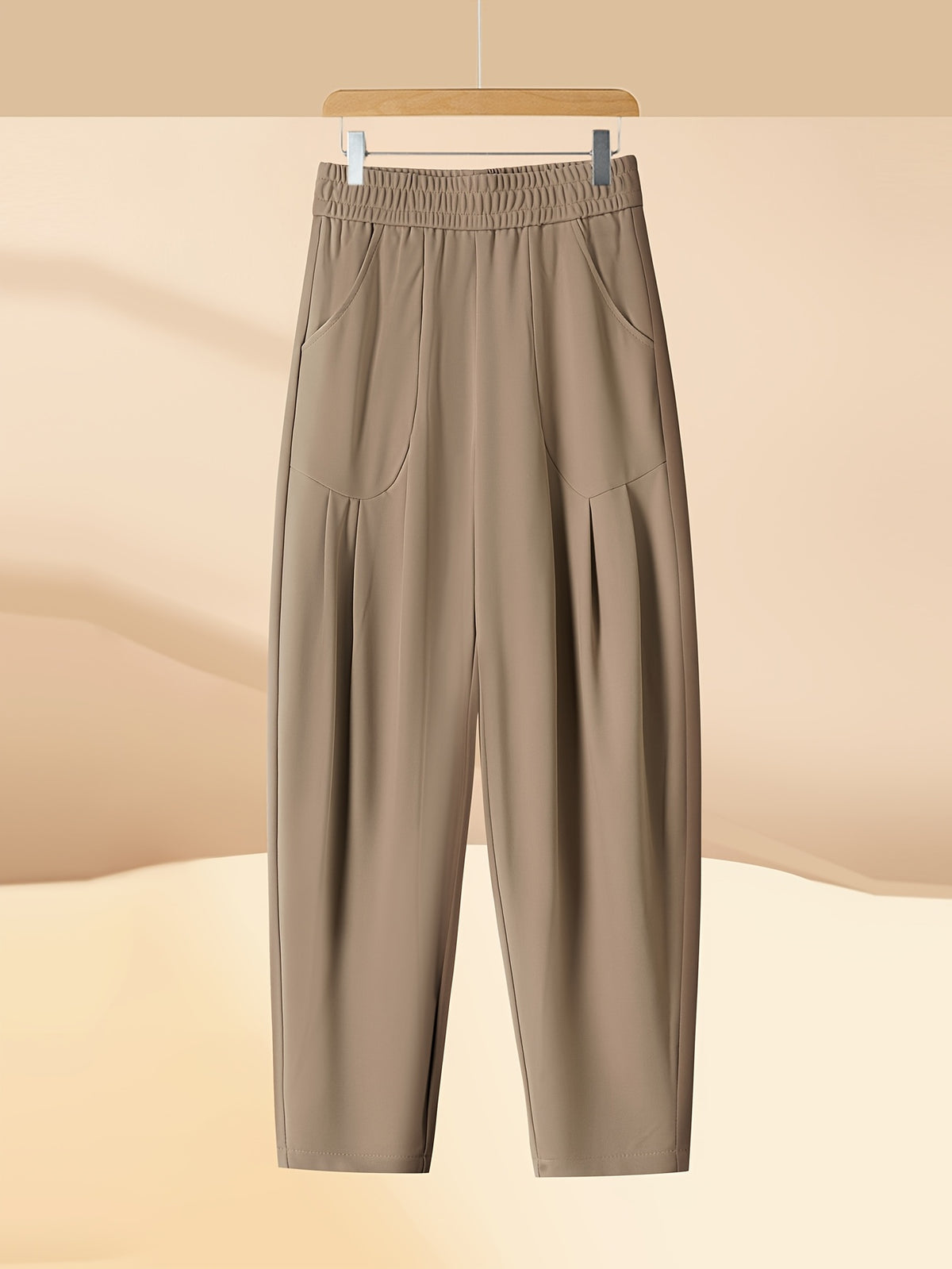 Pantalon carotte grande taille — Maille drapée et plis creux