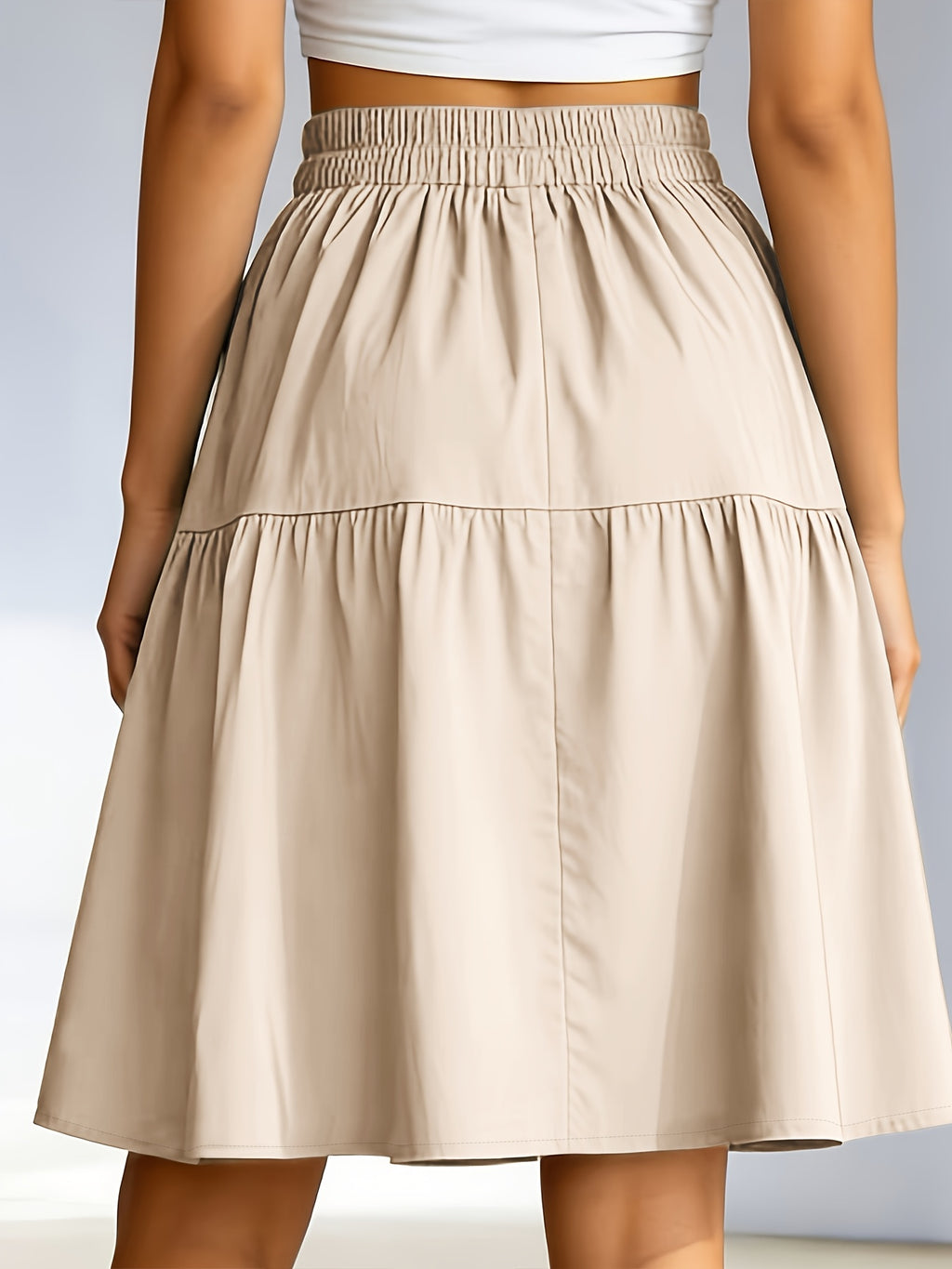 Jupe grande taille, coupe cintrée, poches pratiques, ligne nette, vue de profil