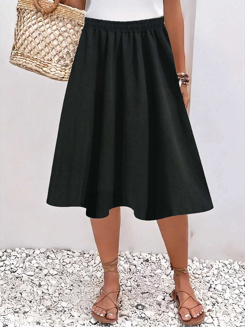 Jupe grande taille, coupe évasée, longueur genou, allure élégante — composition : 100% Polyester