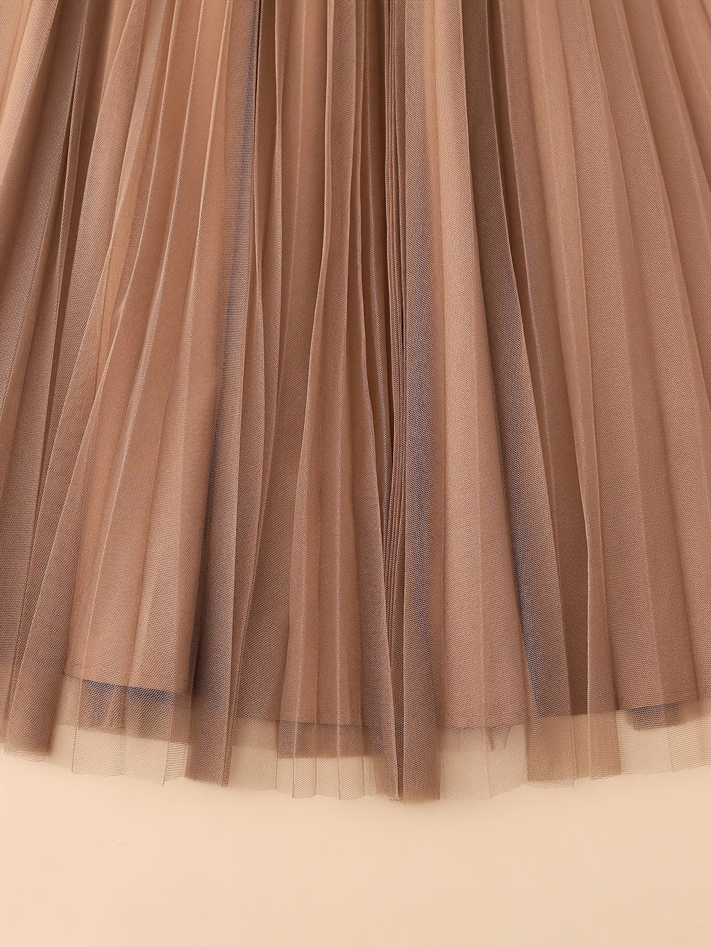 Jupe grande taille, plissés, allure élégante, détail du tissu