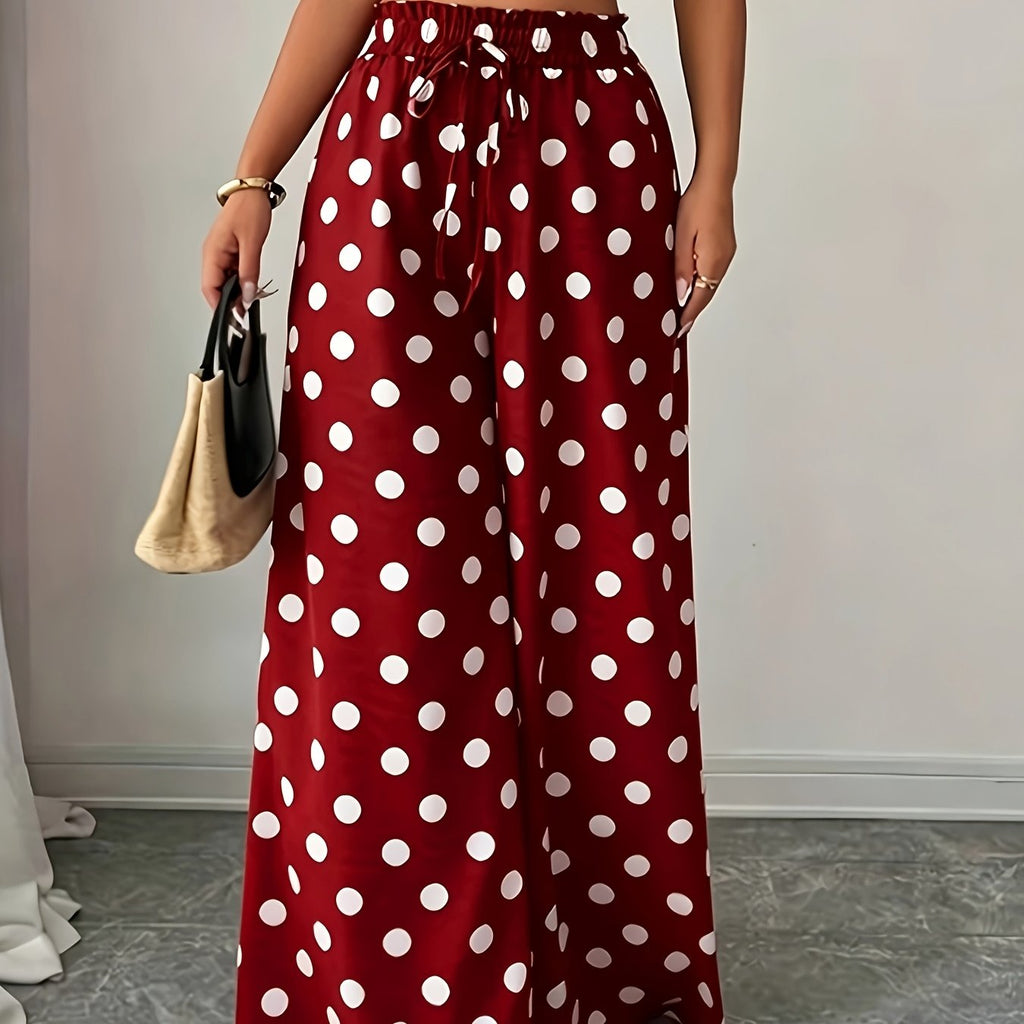 Pantalon grande taille à pois, coupe évasée, porté de face