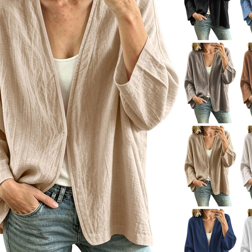 Veste grande taille en lin, coupe ample, encolure nette, manches longues, détail du col