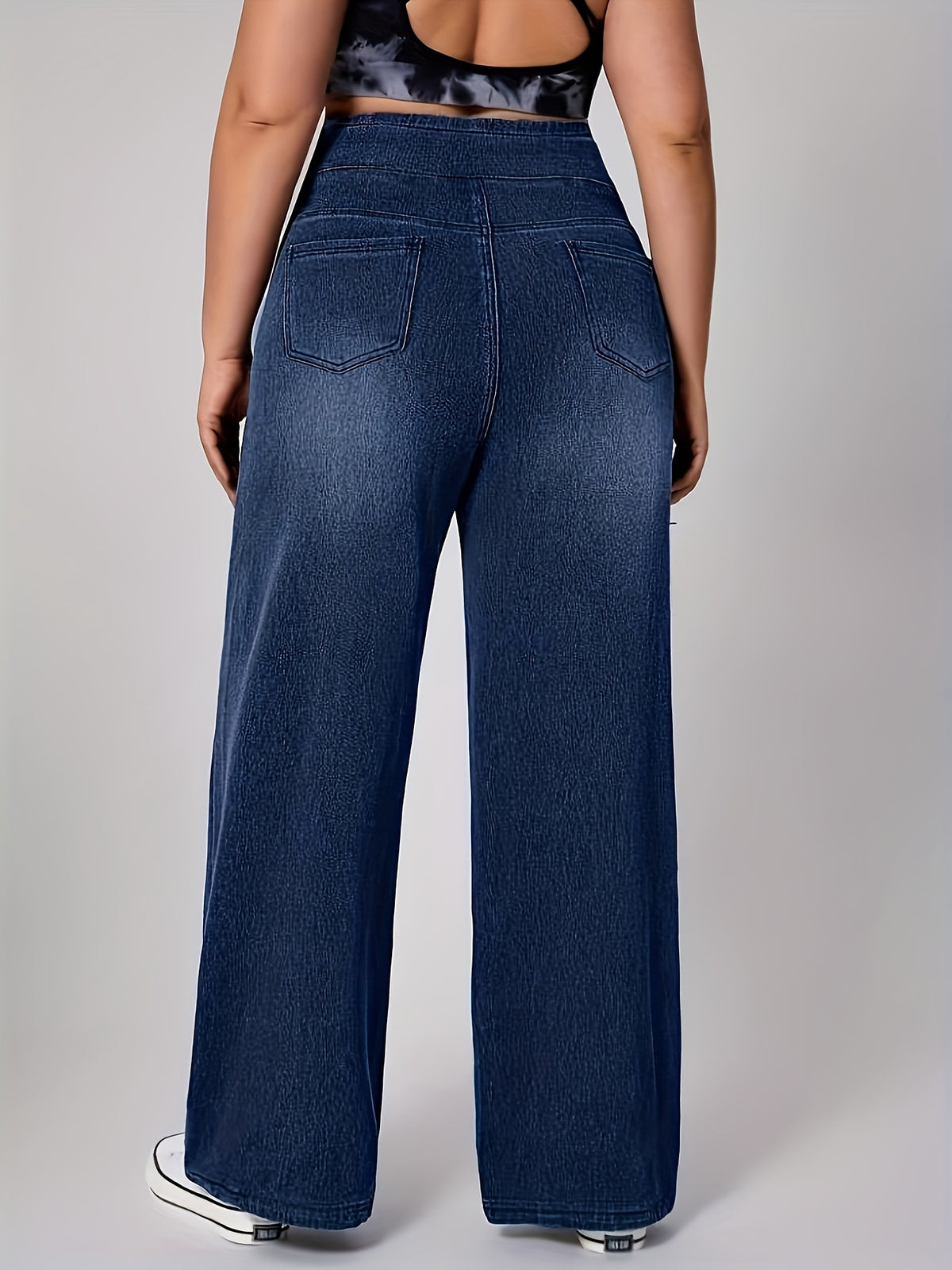 Pantalon grande taille, coupe évasée, délavage doux, tenue franche, détail du tissu