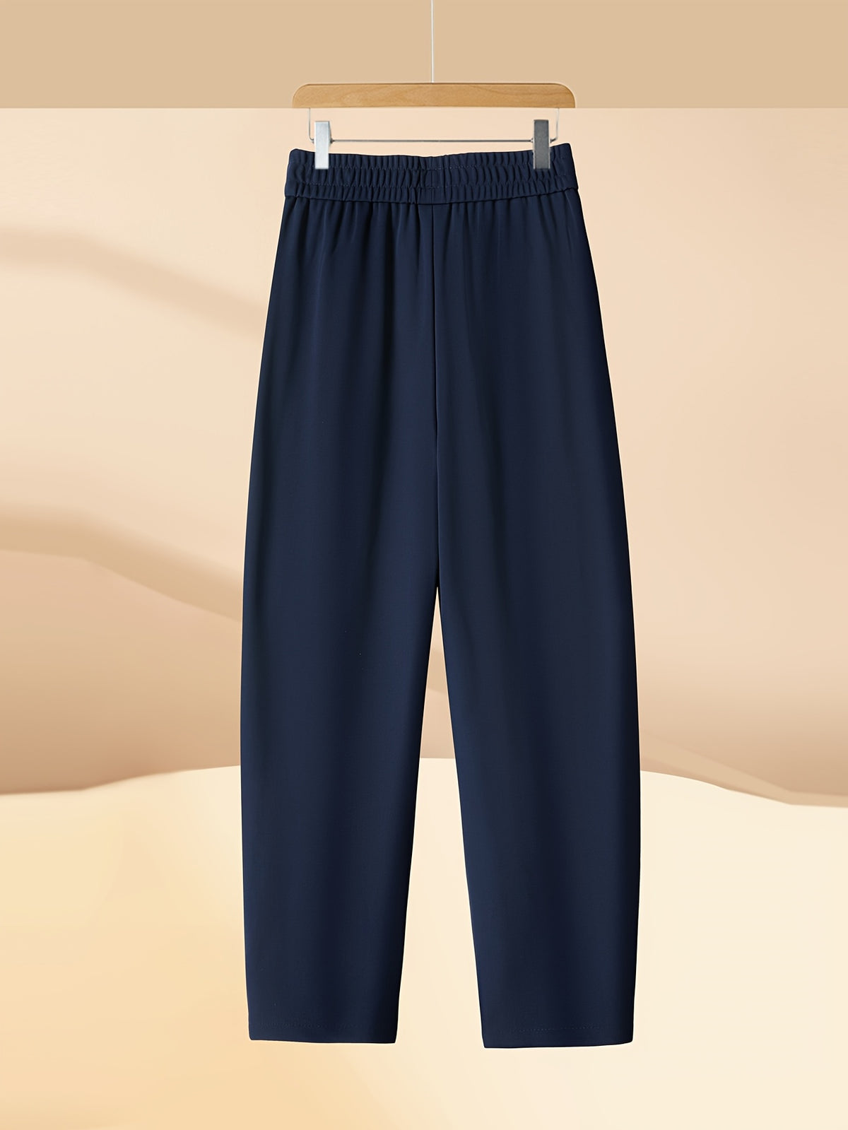 Pantalon carotte grande taille — Maille drapée et plis creux
