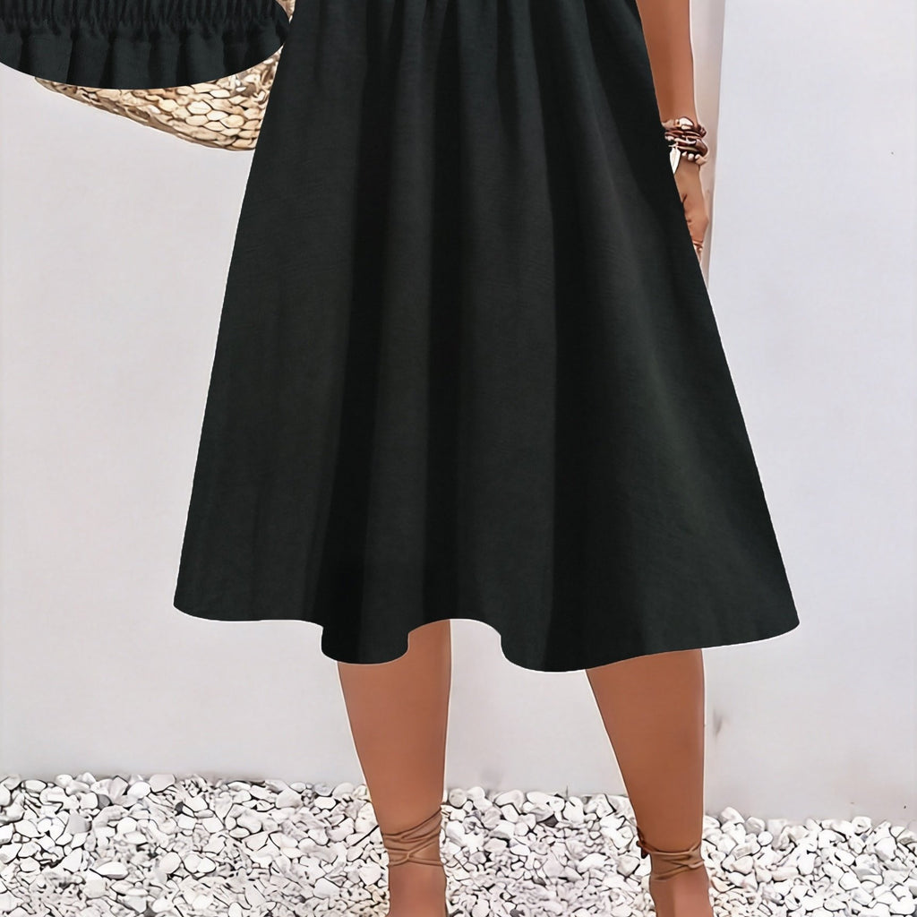 Jupe grande taille, coupe évasée, longueur genou, allure élégante — matière : polyester