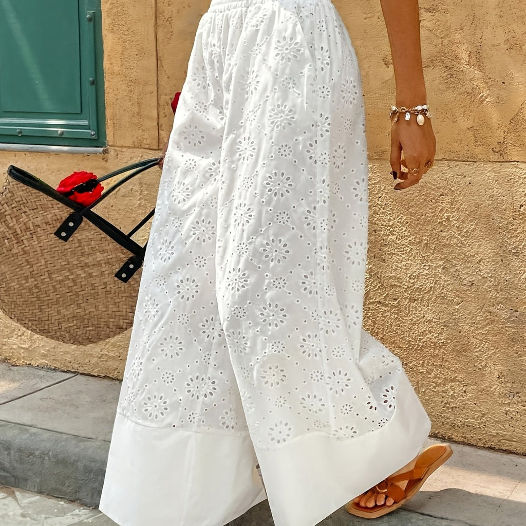 Pantalon grande taille à broderies, coupe évasée, ligne nette