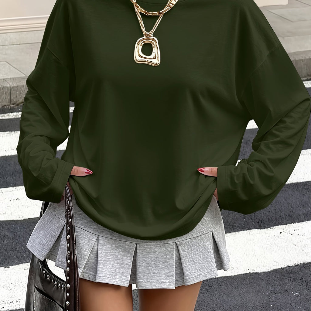 Top grande taille, coupe ample, manches longues, détail du tissu