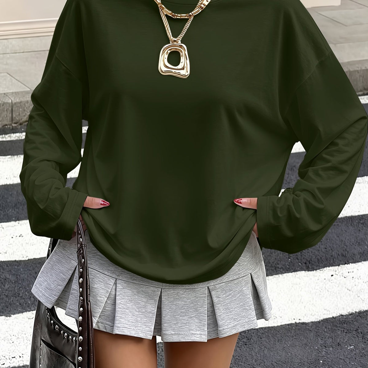 Top grande taille, coupe ample, manches longues, détail du tissu