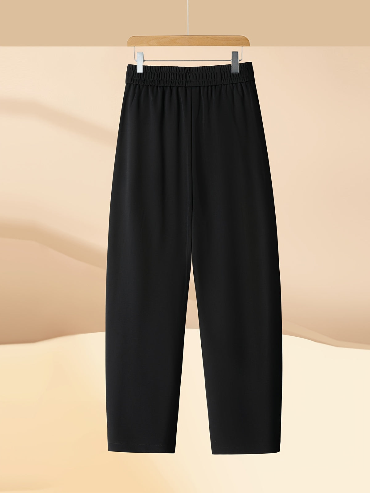 Pantalon carotte grande taille — Maille drapée et plis creux