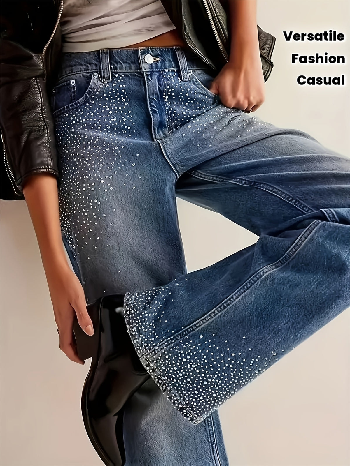 Jean grande taille à broderies, coupe droite, tenue franche, délavage — matière : denim