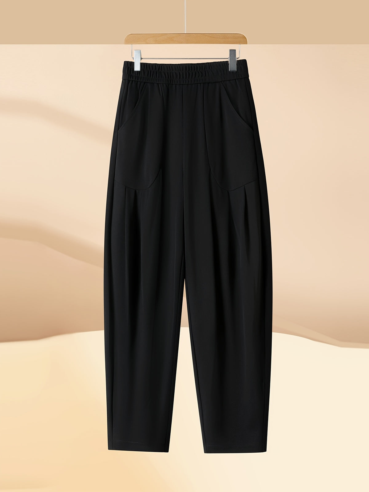Pantalon carotte grande taille — Maille drapée et plis creux