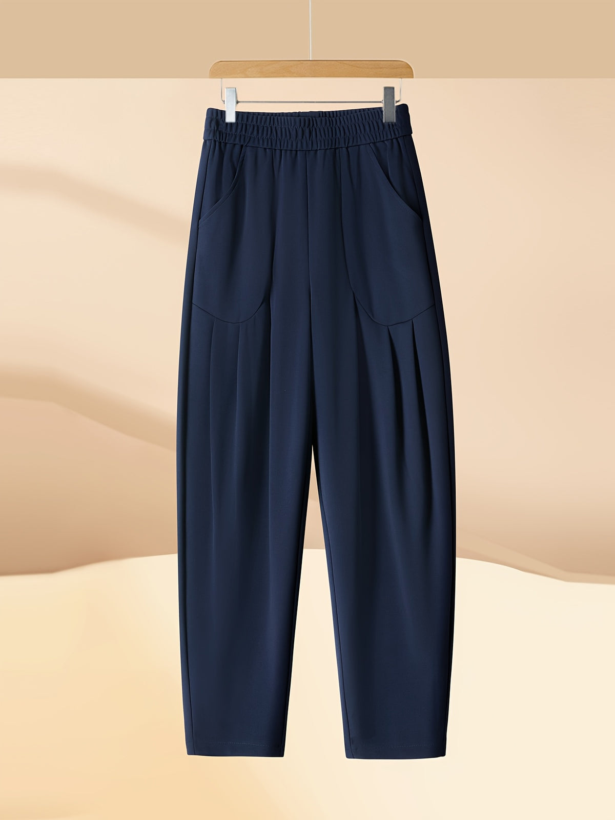 Pantalon carotte grande taille — Maille drapée et plis creux