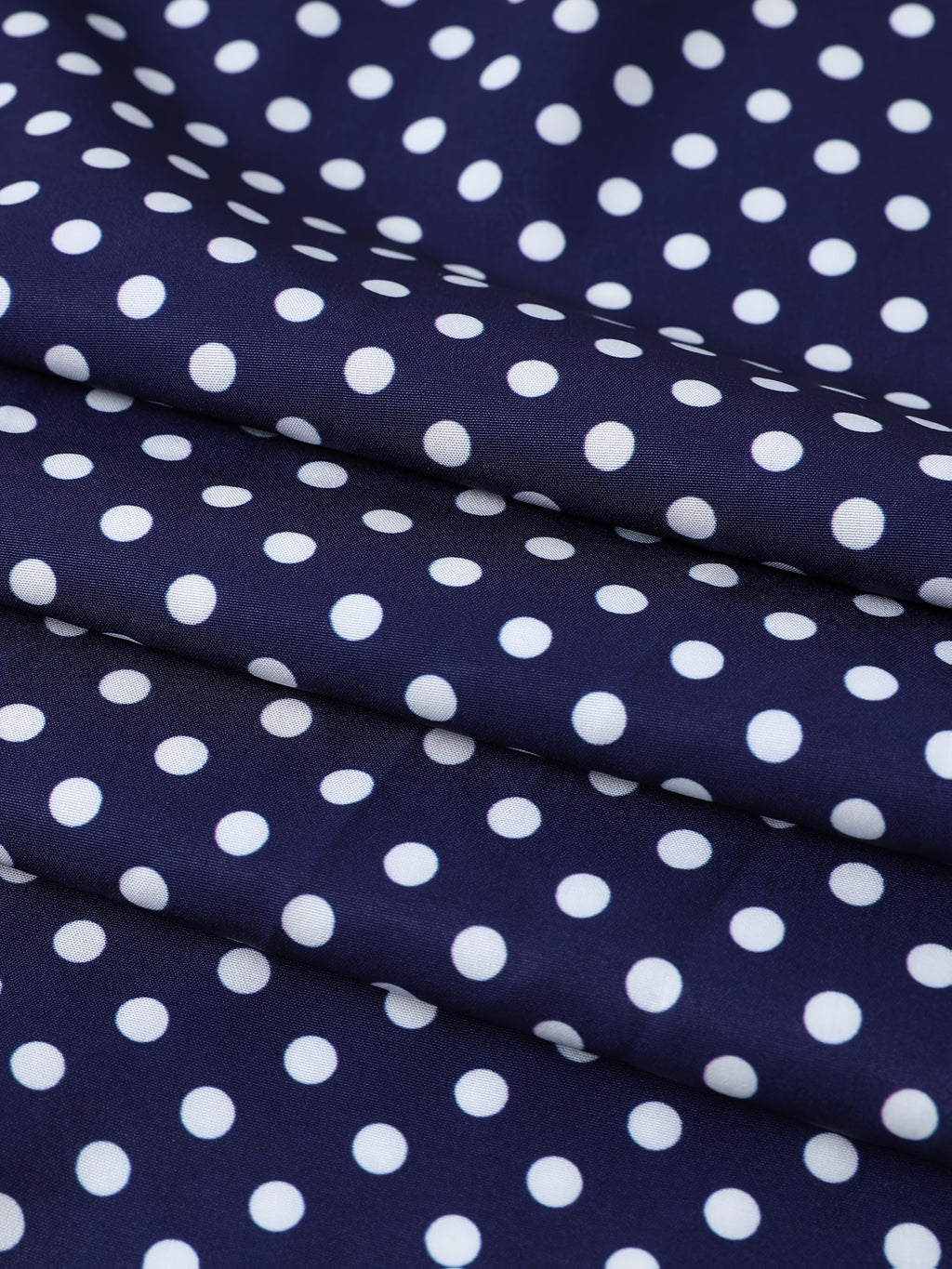 Jupe grande taille à pois, coupe évasée, ceinture assortie, vue de profil