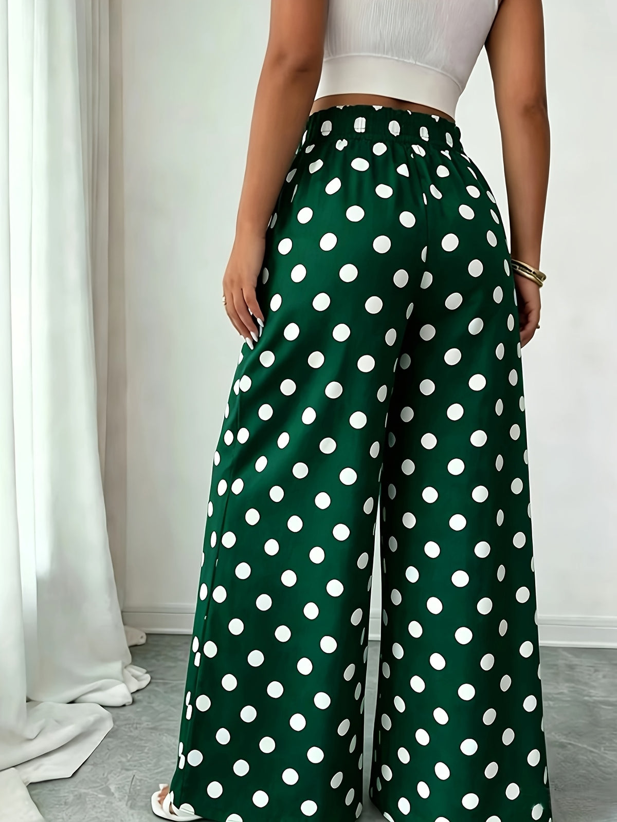 Pantalon grande taille à pois, coupe évasée, visuel produit