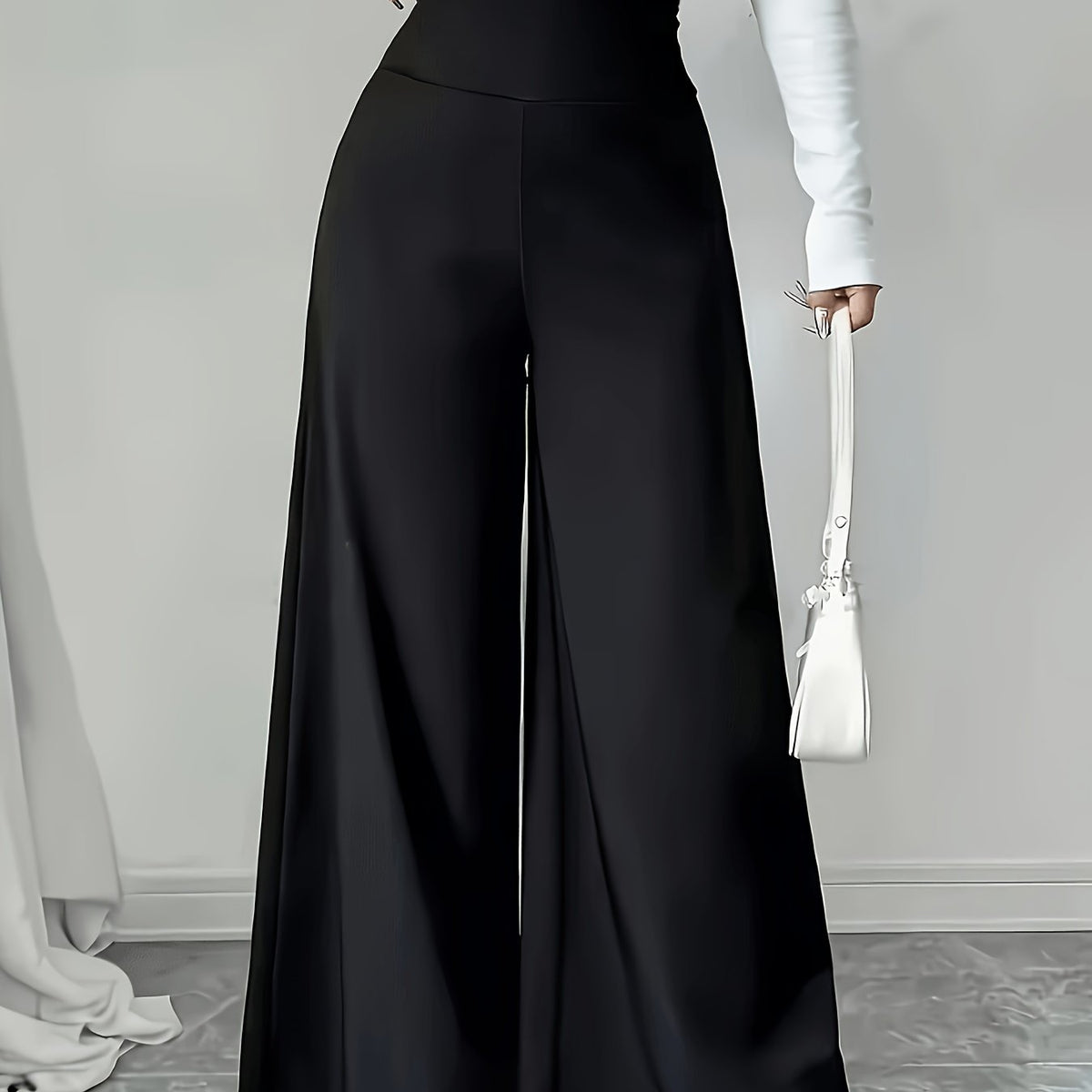Pantalon grande taille, coupe évasée, jambe large, esprit décontracté, porté de face