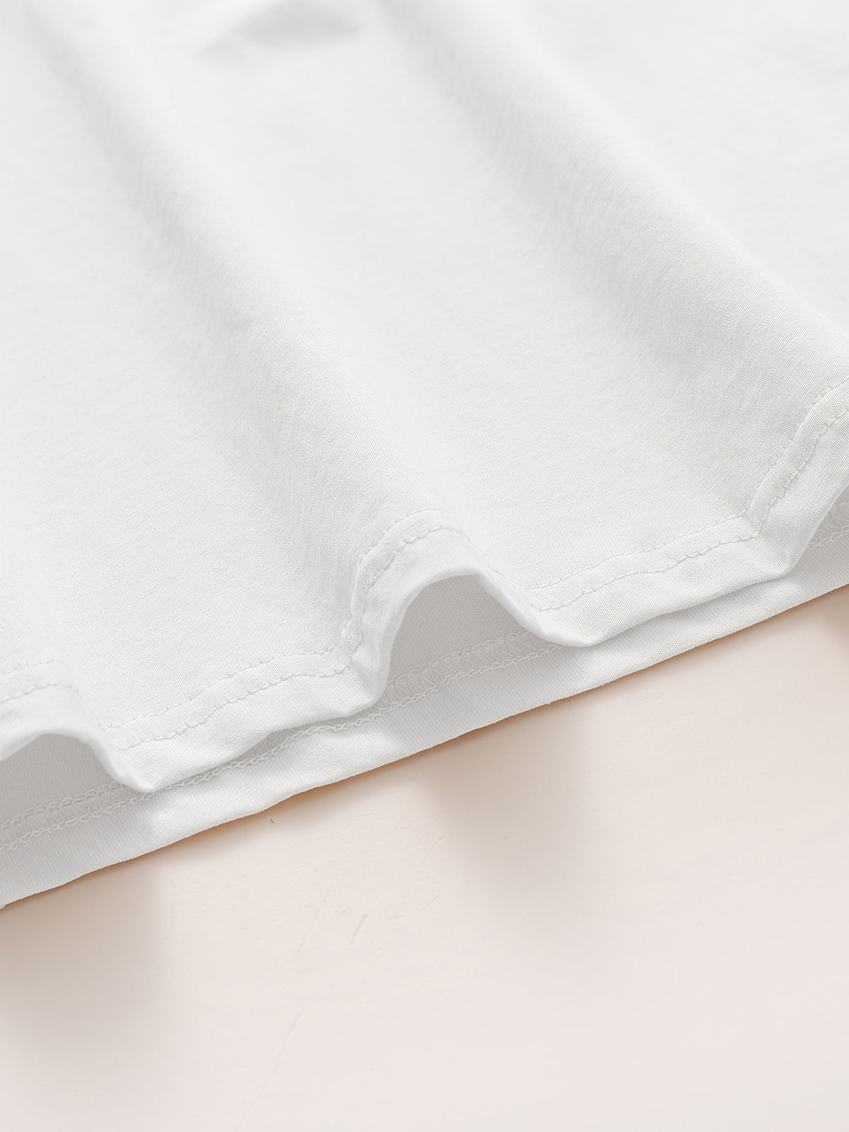 Top grande taille, col rond, manches longues, toucher naturel, détail du tissu
