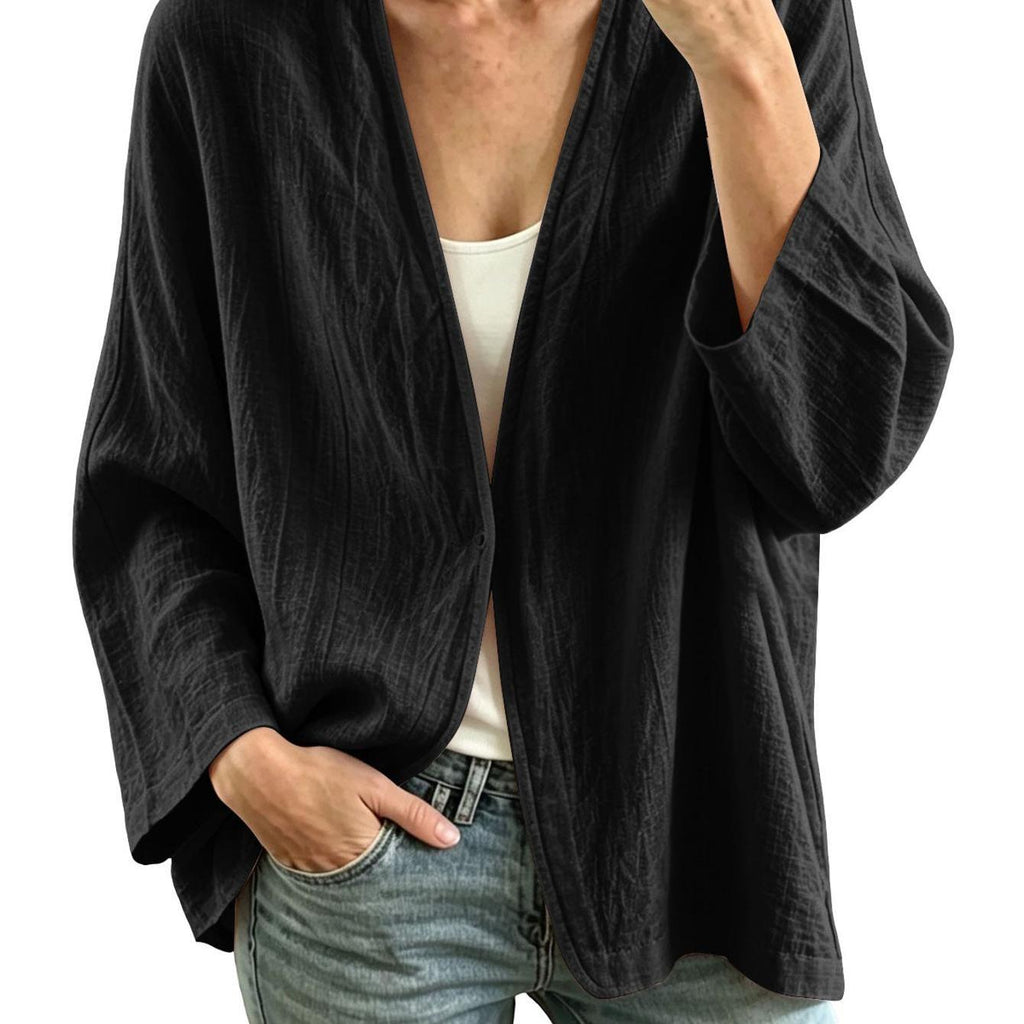 Veste grande taille en lin, coupe ample, encolure nette, manches longues, vu de dos
