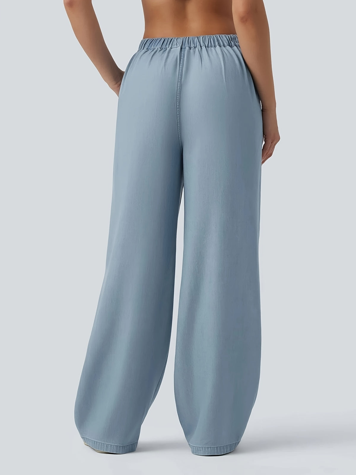 Pantalon grande taille, coupe évasée, délavage doux, tenue franche, détail du tissu