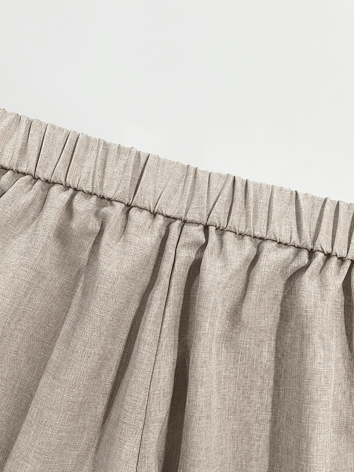 Pantalon beige grande taille — Liseré brun et plis larges