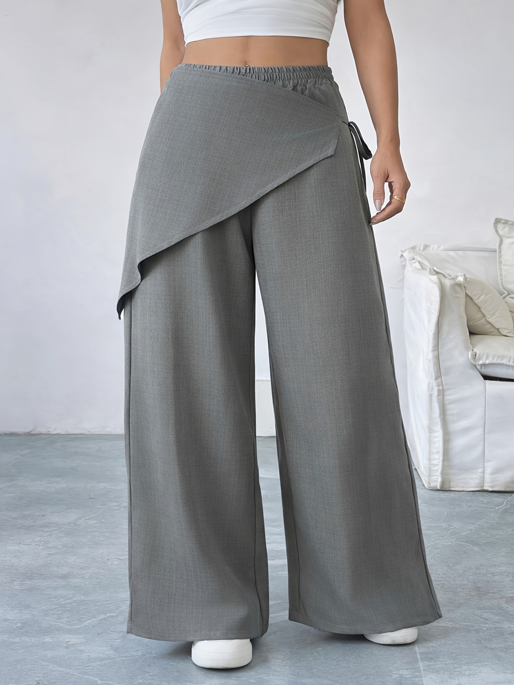 Pantalon noir grande taille — Pan drapé croisé sur le devant